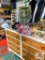 table with 2 chairs, chest of drawers, 2 children's chairs, woven blankets, trial boss hat