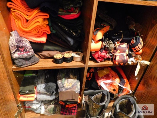 remainder of cabinet: hunting clothes, headwear, socks, gloves etc.