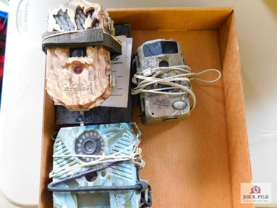 3 slightly used trail camera