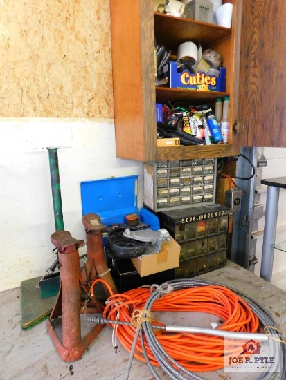 contents of shelf and table- nuts, bolts, cleaning supplies, jack stands, etc..