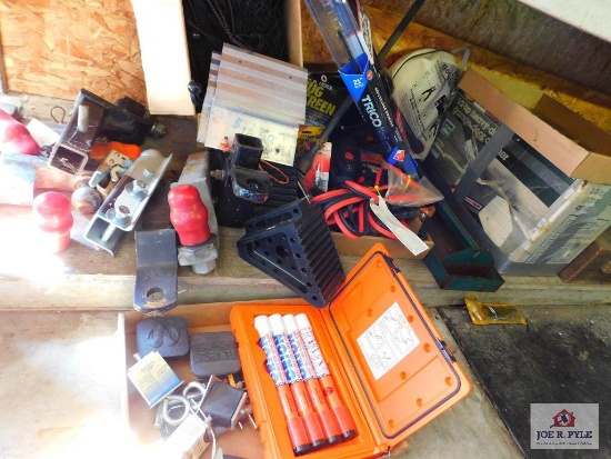large lot under table: truck hitches, windshield wipers, saw blades, nails, etc..