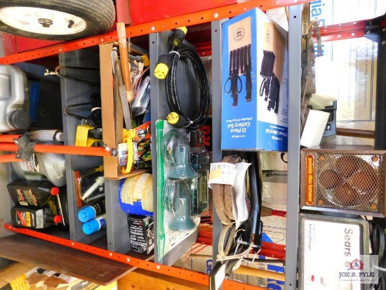 shelf and contents: battery charger, oils, electric cords, blades, etc.