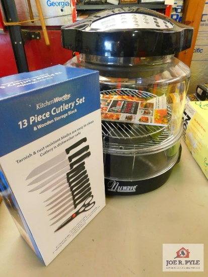 new wave cooker and a cutlery set