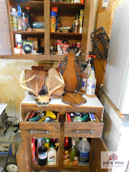 contents of cabinets: cleaning products, hose nozzles, blank plaques, craftsman mesh and wool