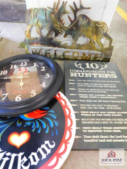 laser cut "welcome" sign, whitetails unlimited clock, and hunters ten commandments wall hanging