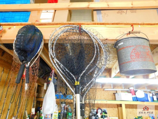 group of fishing nets and minnow bucket