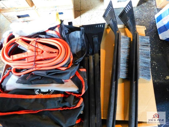 collection of jumper cables, and ice scrapers
