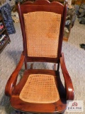 wooden rocker with cane seat and back