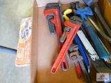 Coleman air compressor, crowbars, and pipe wrenches