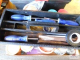 toolbox with nuts, bolts, screwdrivers, and wire brushes