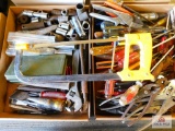 2 flats: hacksaw, screwdrivers, wrenches, pliers etc..