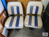 2 boat seats on a metal base