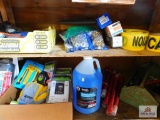 contents of cabinet: tape measure, flashlight, utility knives, flares and plastic sheeting