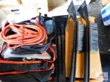 collection of jumper cables, and ice scrapers