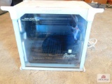 rotisserie oven with collection of knives