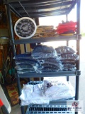 shelf and contents of : sweatshirts and clock