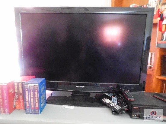 40 inch sharp tv, Phillips DVD/VCR includes stand , movies, books
