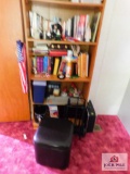 Bookshelf and contents: books decorative items, footstool