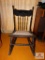 antique rocker with carved back