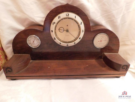 Mantle style clock{electric}w thermometer and barometer