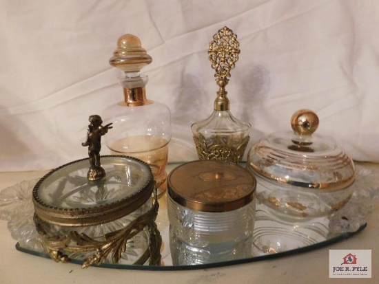 Fancy dresser pieces on mirror with glass handles