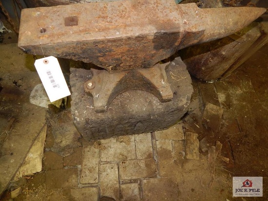 Large anvil on wooden base