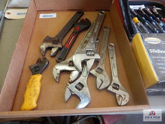 Flat of adjustable end wrenches