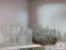 Collection of glassware, shot glasses on lazy Susan