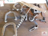Hand drill, wood block, horse shoes