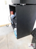 Black storage unit (contents not included)