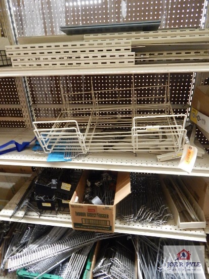 1 large lot of peg board hooks display racks etc.