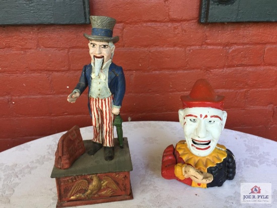 2 cast iron mechanical banks: clown and Uncle Sam