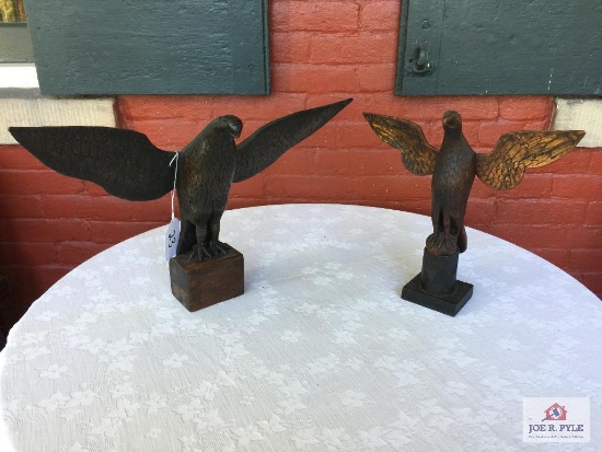 Two carved wooden eagles