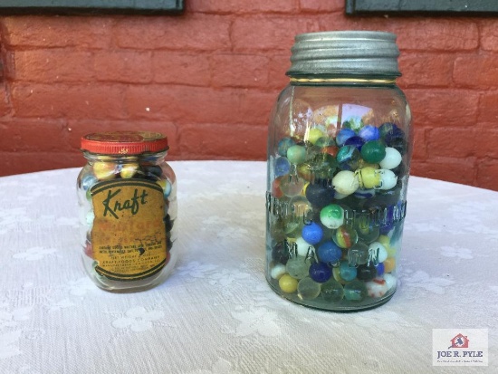 Two jars of antique marbles