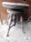 Antique piano stool with glass ball feet
