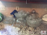 Lot of glass on counter: Punch bowls, cups, etc.