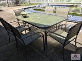Glass metal table and six chairs