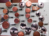 Wall Of Copper Bottom Pots And Pans