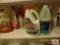 contents on shelf cleaning supplies, mops, brooms