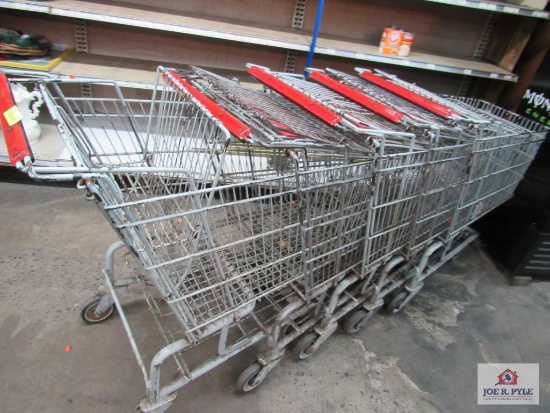 5 red handled shopping carts