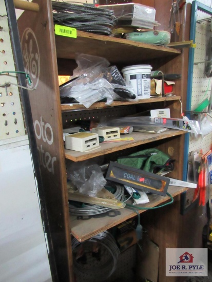 wooden shelf w contents, hacksaw, wire, extension cords,