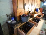 Contents of drawer, chisels, hammers, saw blades, electric stapler, tool caddies, trouble light