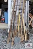 Assorted shovels, rakes, splitting maul