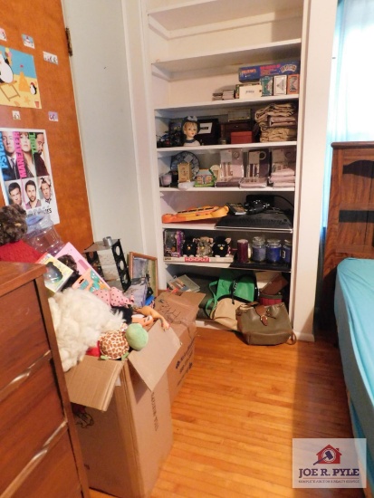 Contents of shelves and children's toys, puzzles and stuffed animals, collection of purses, curtain