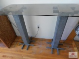 Glass-top table with pillars