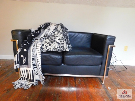 Leather like love seat, includes throws and pillows