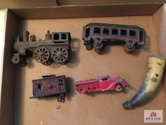 Antique cast iron train, dump truck and Childs powder horn