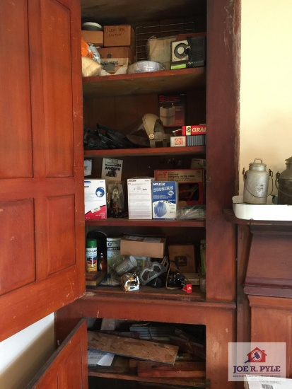 Contents of cabinet: tractor parts, fluids, work accessories, etc.