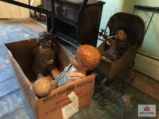 Antique tin doll buggy and doll and three composition dolls