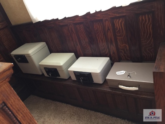 Three fireproof safes with keys and metal document box with key